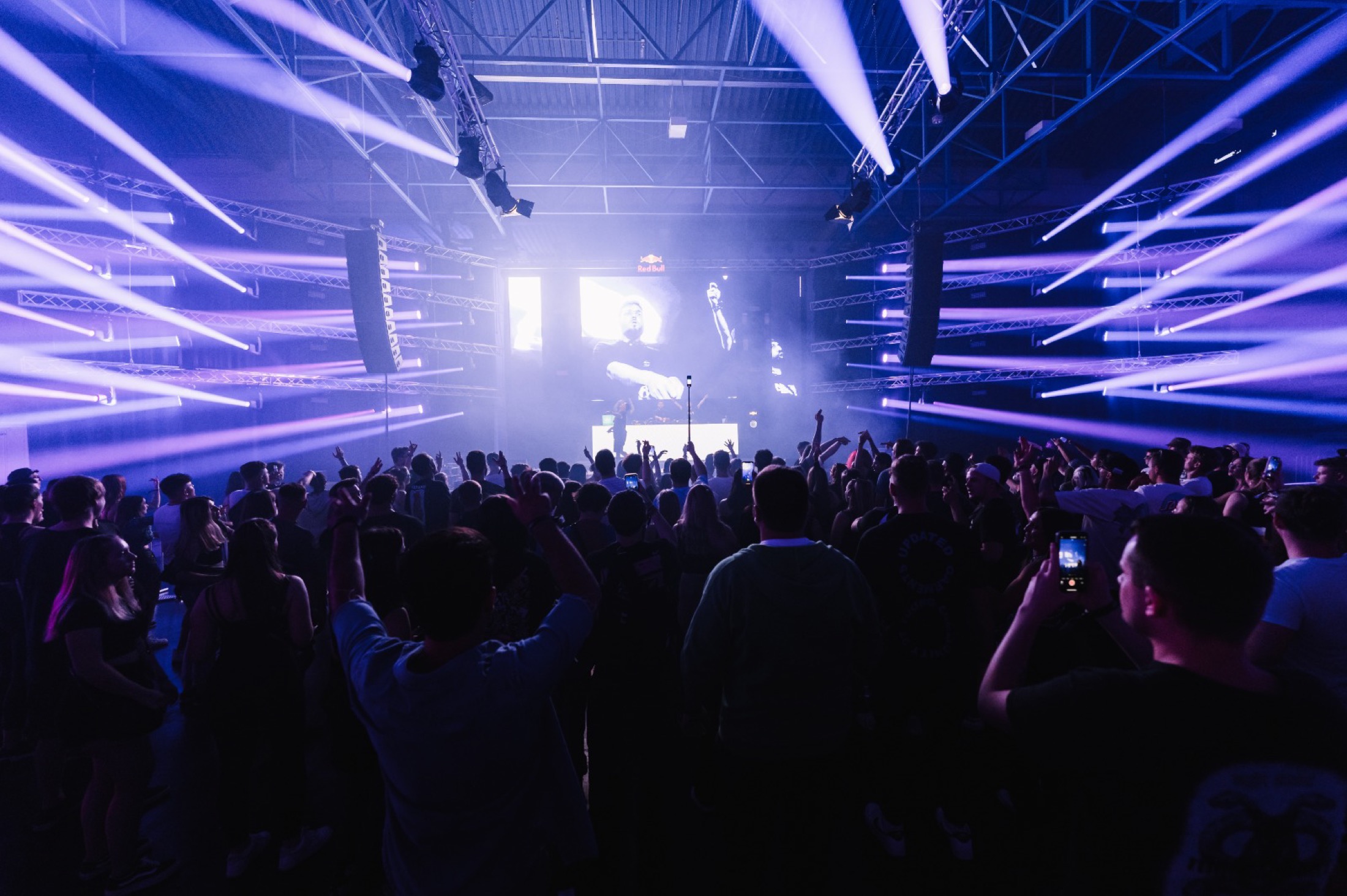 Green beams over a live crowd