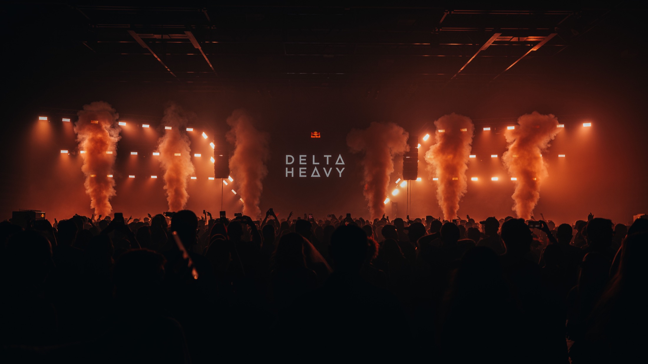 Blue beams over a live crowd
